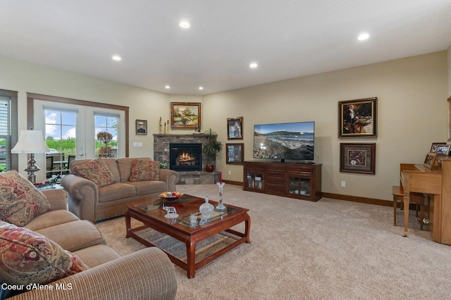 2795 Boekel Rd, Rathdrum, ID 83858 - living area featuring light colored carpet, recessed lighting, baseboards, a fireplace, and french doors