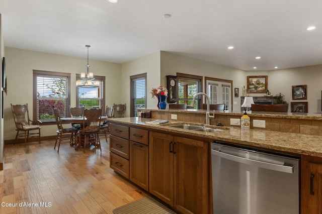 2795 Boekel Rd, Rathdrum, ID 83858 - kitchen featuring dishwasher, a sink, brown cabinets, recessed lighting, and light wood finished floors