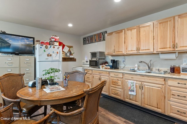 2795 Boekel Rd, Rathdrum, ID 83858 - kitchen with light brown cabinets, freestanding refrigerator, a sink, light countertops, and recessed lighting