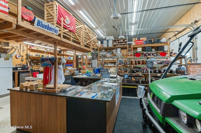 2795 Boekel Rd, Rathdrum, ID 83858 - garage with freestanding refrigerator and a workshop area