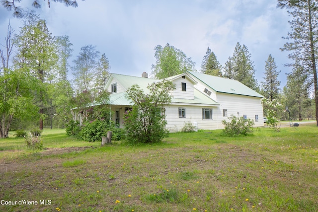 919 Silver Springs Rd, Moyie Springs, ID 83845 - view of side of property featuring a chimney and metal roof