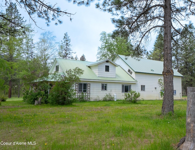 919 Silver Springs Rd, Moyie Springs, ID 83845 - rear view of house with a chimney and metal roof