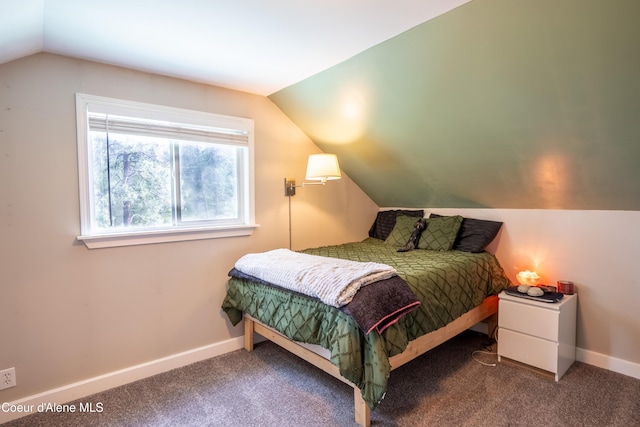 919 Silver Springs Rd, Moyie Springs, ID 83845 - bedroom with lofted ceiling, carpet floors, and baseboards