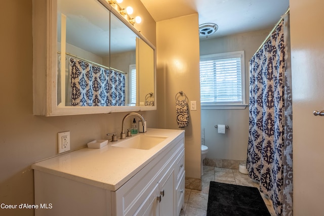 919 Silver Springs Rd, Moyie Springs, ID 83845 - full bath featuring toilet, vanity, and tile patterned floors