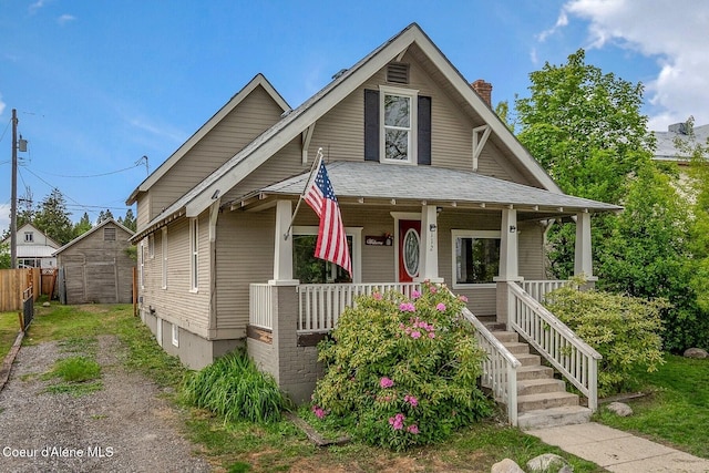 112 Washington St, Priest River, ID 83856 - view of front of house with covered porch and a chimney