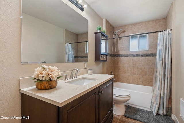 112 Washington St, Priest River, ID 83856 - full bath with vanity, toilet, shower / tub combo, tile patterned floors, and a textured wall