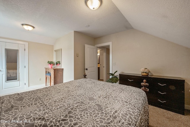 112 Washington St, Priest River, ID 83856 - bedroom with vaulted ceiling, carpet, a textured ceiling, and baseboards