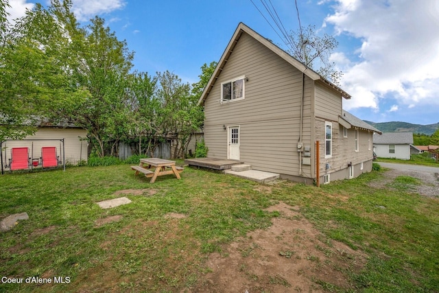 112 Washington St, Priest River, ID 83856 - rear view of house with a yard