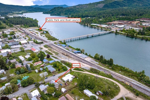 112 Washington St, Priest River, ID 83856 - aerial view of property and surrounding area with a forest and a water and mountain view
