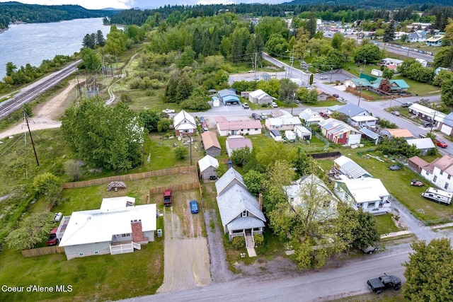 112 Washington St, Priest River, ID 83856 - aerial view of residential area featuring a forest and a large body of water