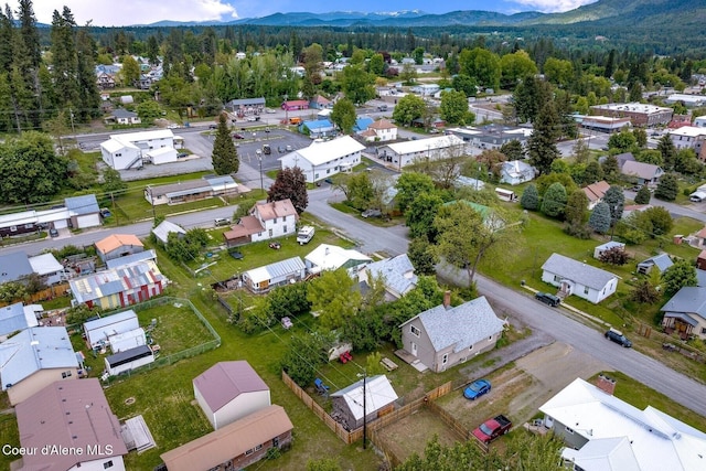 112 Washington St, Priest River, ID 83856 - aerial perspective of suburban area featuring mountains and a forest