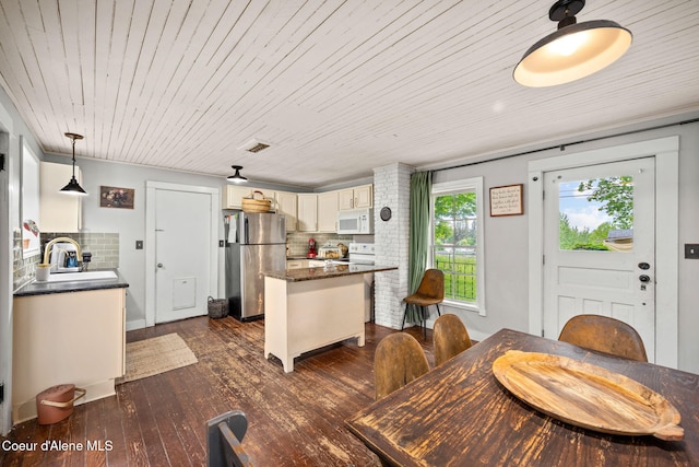 15152 N Mill St, Rathdrum, ID 83858 - dining room featuring dark wood-style flooring and wooden ceiling