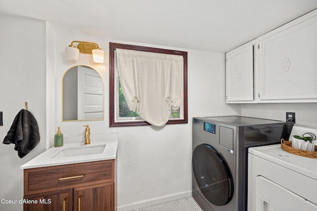15152 N Mill St, Rathdrum, ID 83858 - washroom featuring cabinet space, washer and dryer, and baseboards