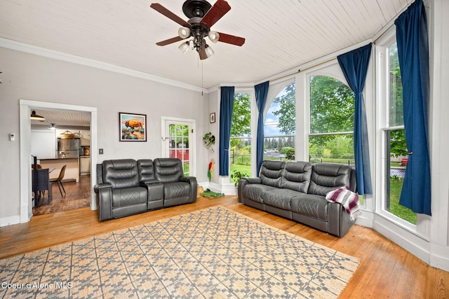 15152 N Mill St, Rathdrum, ID 83858 - living room featuring a ceiling fan, hardwood / wood-style floors, crown molding, and baseboards