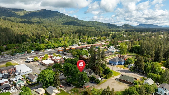 15152 N Mill St, Rathdrum, ID 83858 - aerial view of residential area featuring a heavily wooded area and a mountain backdrop