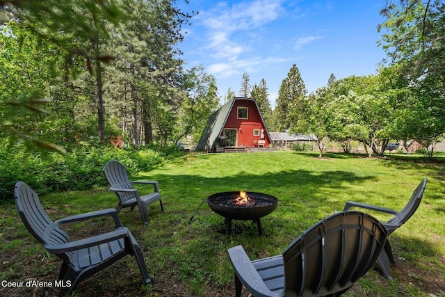 11 Hackney Ln, Sandpoint, ID 83864 - view of grassy yard with a fire pit and a barn
