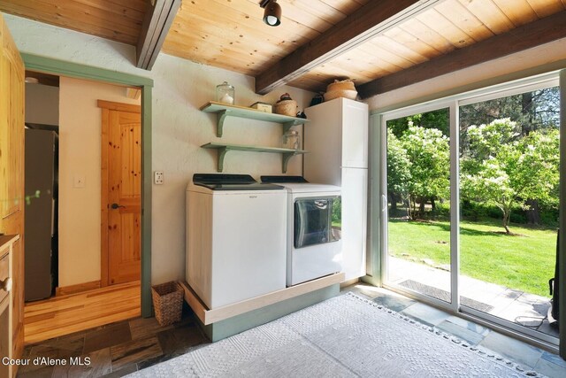 11 Hackney Ln, Sandpoint, ID 83864 - washroom with washing machine and dryer and wooden ceiling