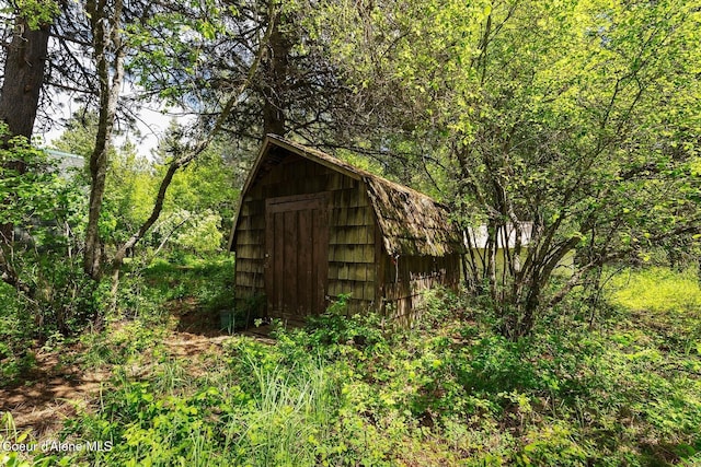 11 Hackney Ln, Sandpoint, ID 83864 - view of shed with a wooded view
