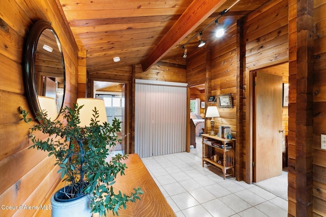 659 Whiskey Jack Rd, Sandpoint, ID 83864 - entryway with wooden walls, light tile patterned floors, and wooden ceiling