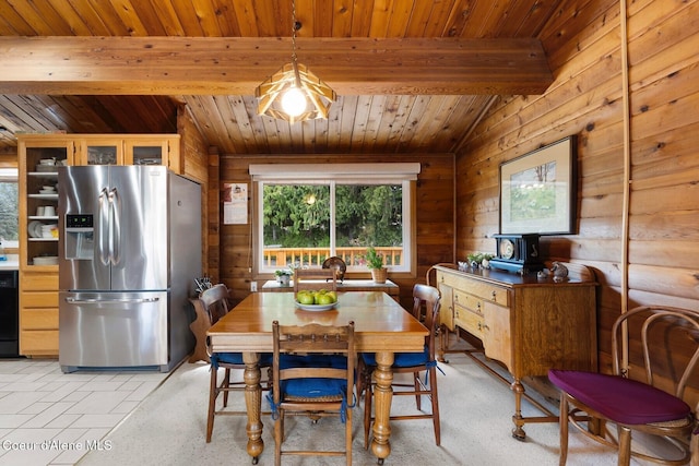 659 Whiskey Jack Rd, Sandpoint, ID 83864 - dining space with plenty of natural light, wood ceiling, and wood walls