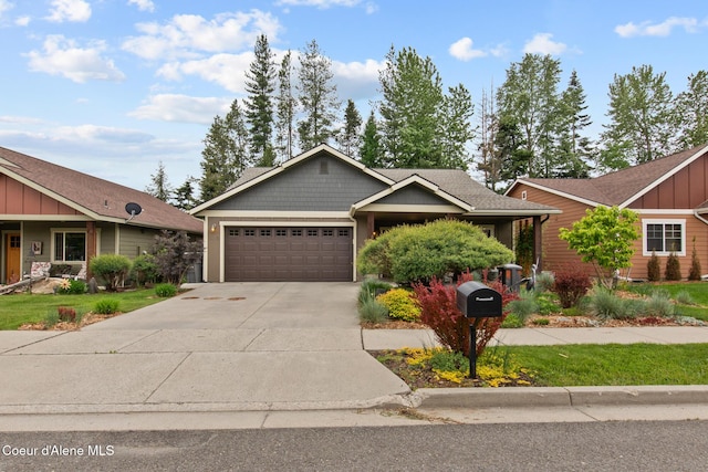 305 Maddie Ln, Sandpoint, ID 83864 - craftsman-style house featuring an attached garage, board and batten siding, and concrete driveway