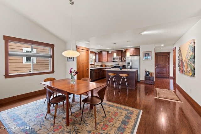 305 Maddie Ln, Sandpoint, ID 83864 - dining area featuring dark wood-style floors, baseboards, lofted ceiling, and recessed lighting