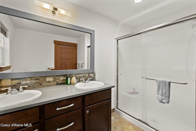 305 Maddie Ln, Sandpoint, ID 83864 - full bath featuring tasteful backsplash, double vanity, and a shower stall