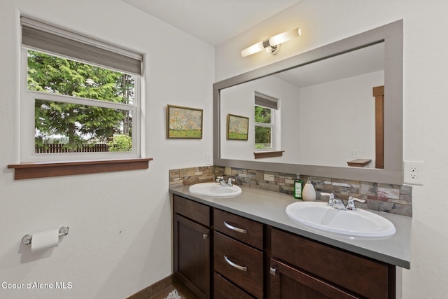 305 Maddie Ln, Sandpoint, ID 83864 - full bath with double vanity, plenty of natural light, backsplash, and baseboards