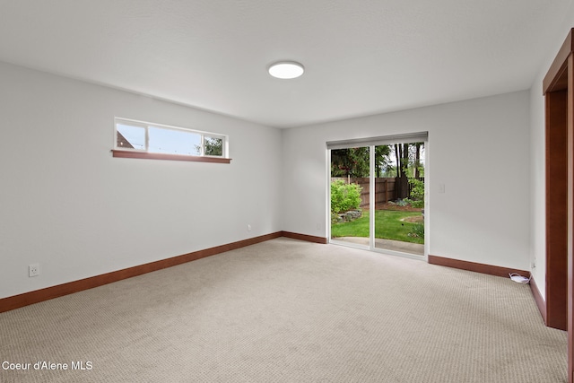 305 Maddie Ln, Sandpoint, ID 83864 - empty room with carpet flooring, baseboards, and healthy amount of natural light