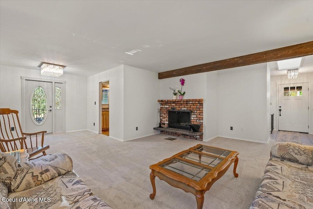 12696 N Dover Ln, Hayden, ID 83835 - living area featuring carpet flooring, baseboards, a chandelier, and a fireplace