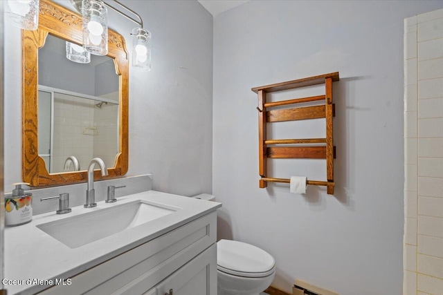 12696 N Dover Ln, Hayden, ID 83835 - full bathroom with toilet, vanity, a shower with door, and a baseboard radiator