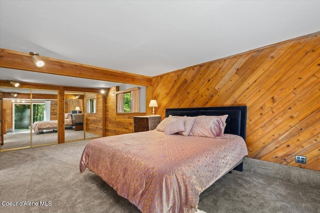 12696 N Dover Ln, Hayden, ID 83835 - carpeted bedroom featuring wooden walls