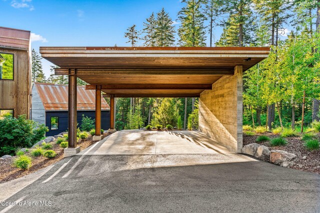 6361 S Cormorant Ct, Harrison, ID 83833 - view of parking / parking lot with asphalt driveway and a carport