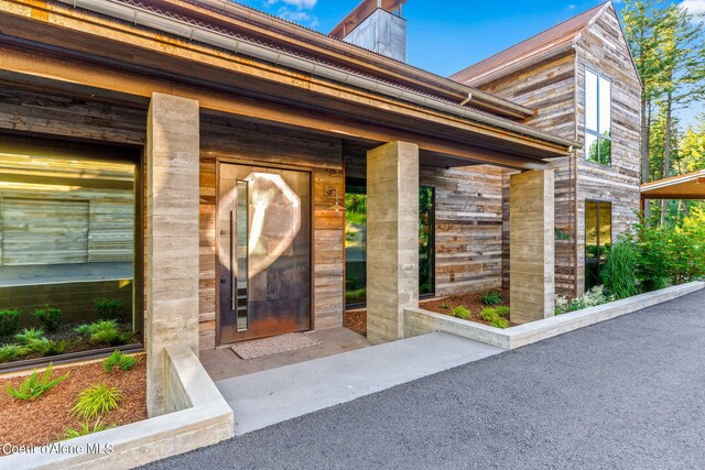 6361 S Cormorant Ct, Harrison, ID 83833 - view of exterior entry featuring a chimney