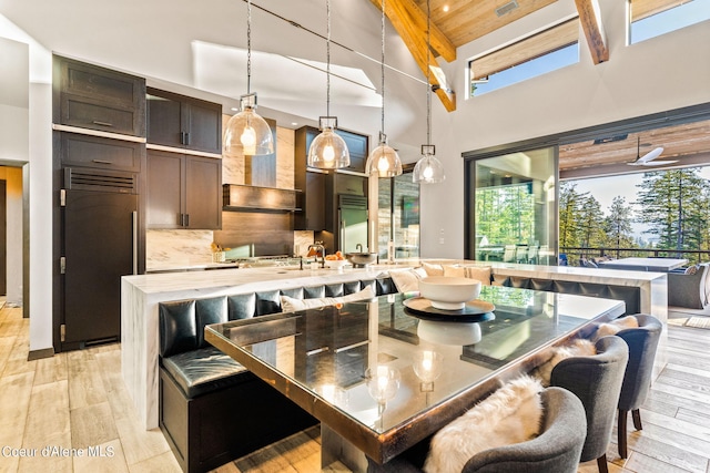 6361 S Cormorant Ct, Harrison, ID 83833 - dining room featuring high vaulted ceiling, light wood-style floors, and beamed ceiling