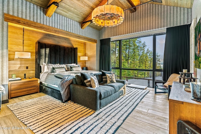 6361 S Cormorant Ct, Harrison, ID 83833 - bedroom with vaulted ceiling, hardwood / wood-style floors, wood ceiling, and wooden walls
