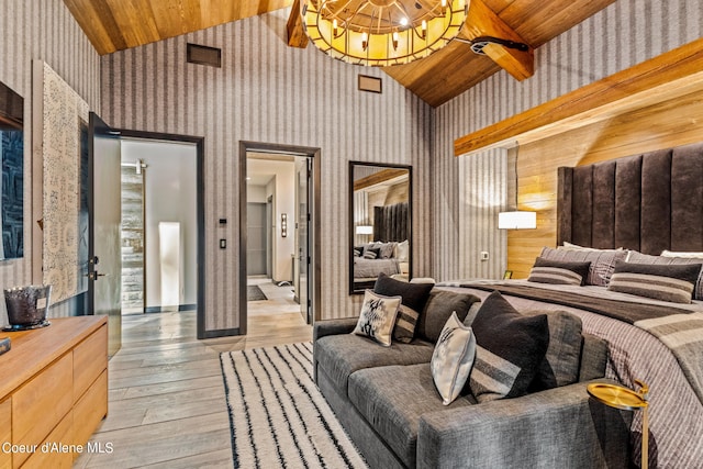 6361 S Cormorant Ct, Harrison, ID 83833 - bedroom featuring lofted ceiling, wood ceiling, wallpapered walls, light wood-type flooring, and a chandelier
