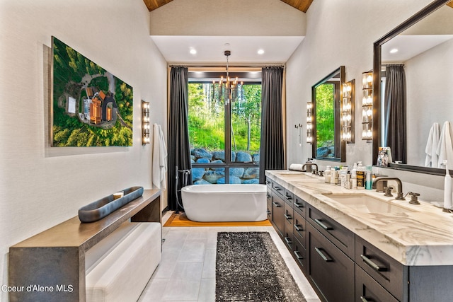 6361 S Cormorant Ct, Harrison, ID 83833 - bathroom with double vanity, a chandelier, a soaking tub, tile patterned flooring, and recessed lighting