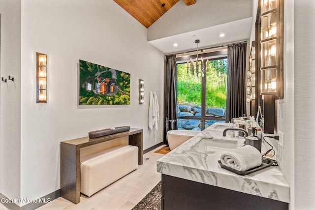 6361 S Cormorant Ct, Harrison, ID 83833 - full bathroom with lofted ceiling, double vanity, wooden ceiling, a freestanding tub, and a chandelier