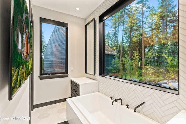 6361 S Cormorant Ct, Harrison, ID 83833 - full bath featuring a bath, plenty of natural light, baseboards, and tile patterned floors