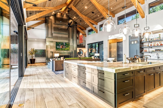 6361 S Cormorant Ct, Harrison, ID 83833 - bathroom featuring high vaulted ceiling, wooden ceiling with exposed beams, a ceiling fan, hardwood / wood-style floors, and vanity