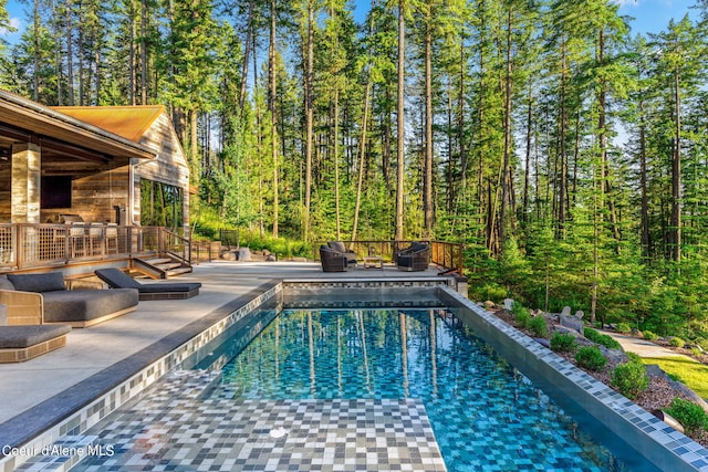 6361 S Cormorant Ct, Harrison, ID 83833 - swimming pool featuring a patio area and a forest view