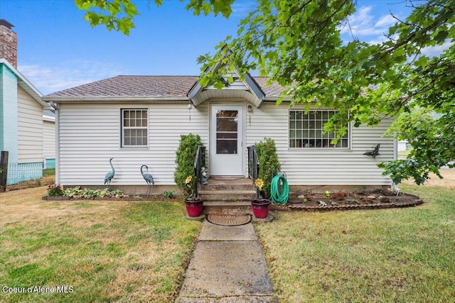 301 Third St, Osburn, ID 83849 - view of front of property featuring a front lawn and roof with shingles
