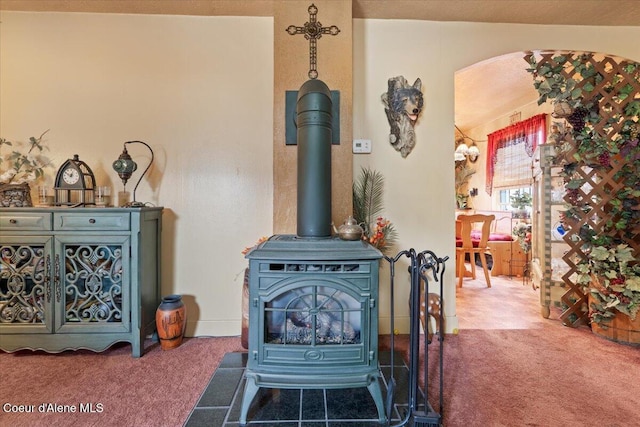 301 Third St, Osburn, ID 83849 - detailed view of carpet floors and a wood stove