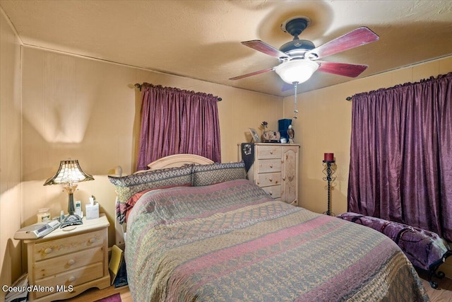 301 Third St, Osburn, ID 83849 - bedroom with wood finished floors and a ceiling fan