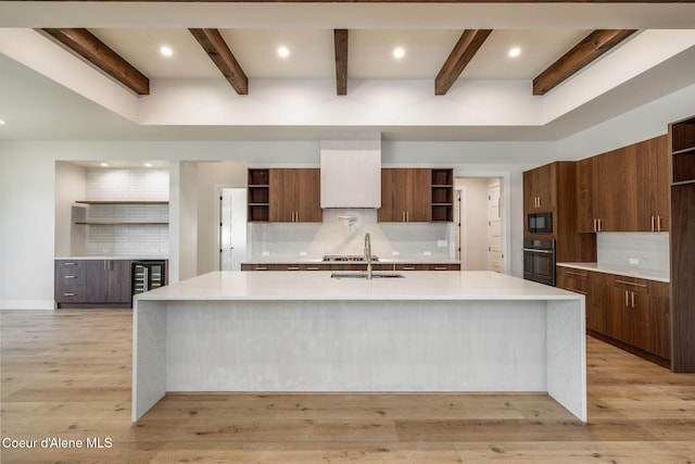 1456 E Ezra Ave, Hayden, ID 83835 - kitchen with open shelves, black appliances, a sink, light countertops, and beam ceiling