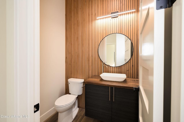 1456 E Ezra Ave, Hayden, ID 83835 - bathroom featuring toilet, vanity, and baseboards