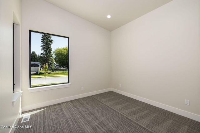 1456 E Ezra Ave, Hayden, ID 83835 - spare room featuring dark colored carpet, baseboards, and recessed lighting