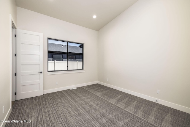 1456 E Ezra Ave, Hayden, ID 83835 - empty room with dark carpet, baseboards, and recessed lighting