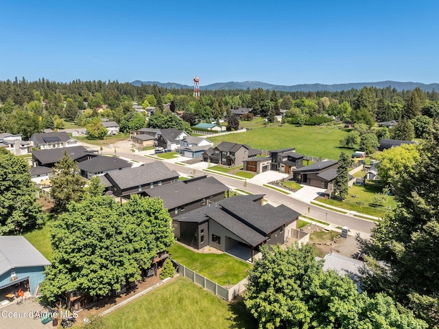 1456 E Ezra Ave, Hayden, ID 83835 - aerial view of residential area with a forest and mountains